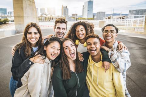 Multiracial group of young friends/students taking selfie picture outdoors